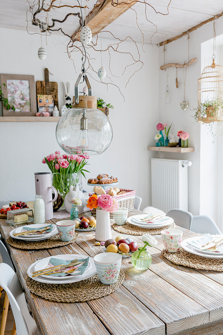 Table set for spring meal in dining room with rustic decorations