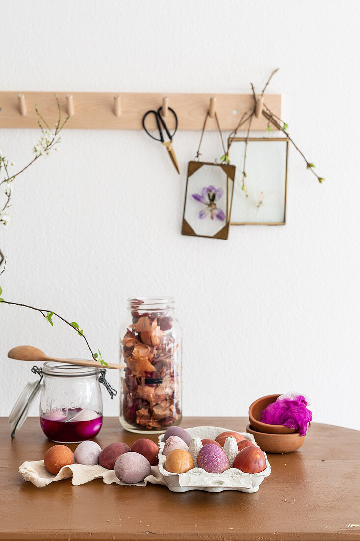 Easter eggs coloured using natural dyes and pressed spring flowers in glass frames