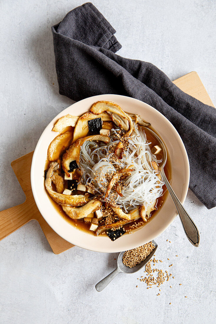 Mushroom soup with glass noodles and sesame seeds
