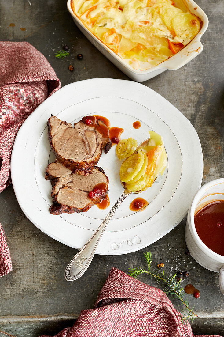 Braised venison shoulder with a pumpkin and potato gratin