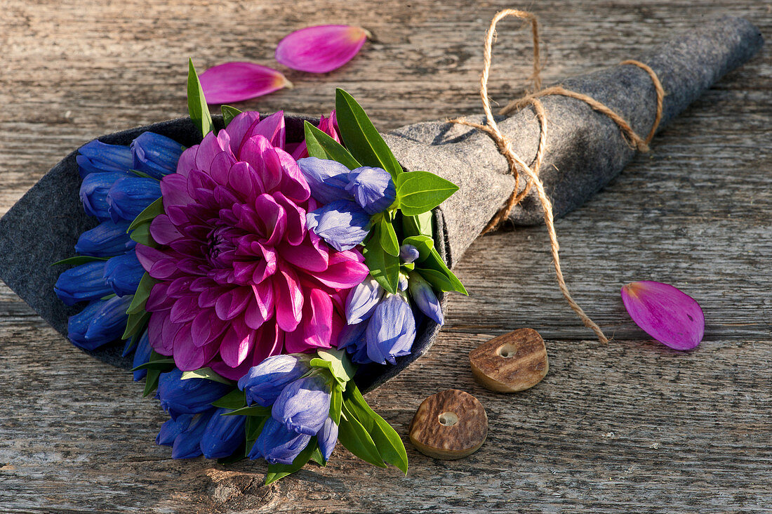 Closed gentian with dahlia blossom made into a bouquet