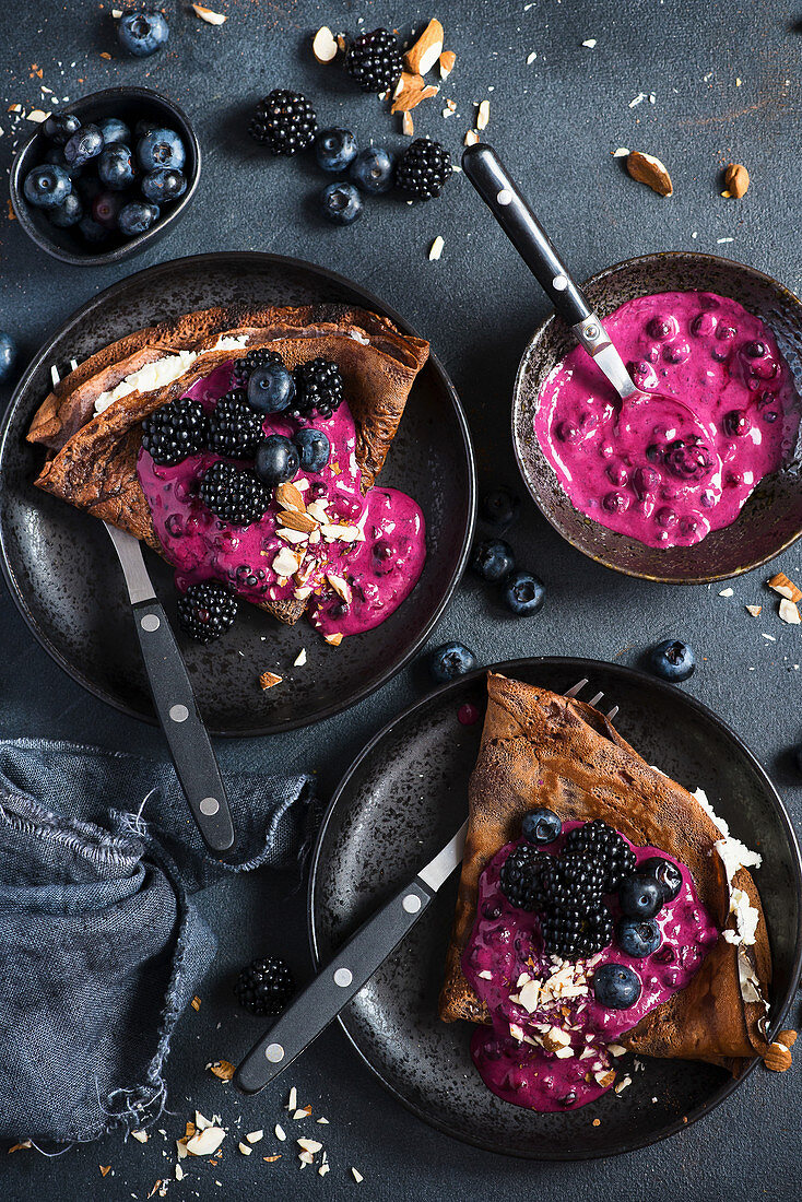Chocolate pancakes with blueberry sauce and blueberries