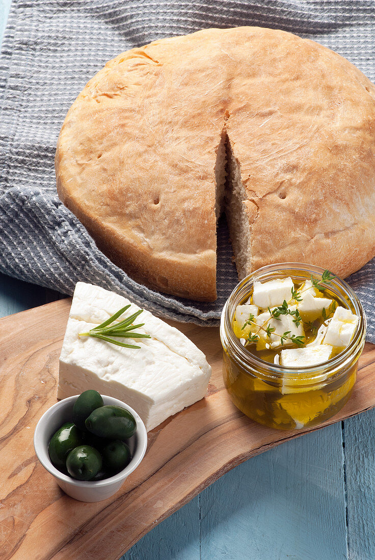 Feta cheese marinated in olive oil and herbs with pita