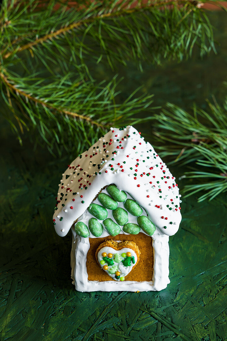 Gingerbread houses decorated with white royal icing for Christmas