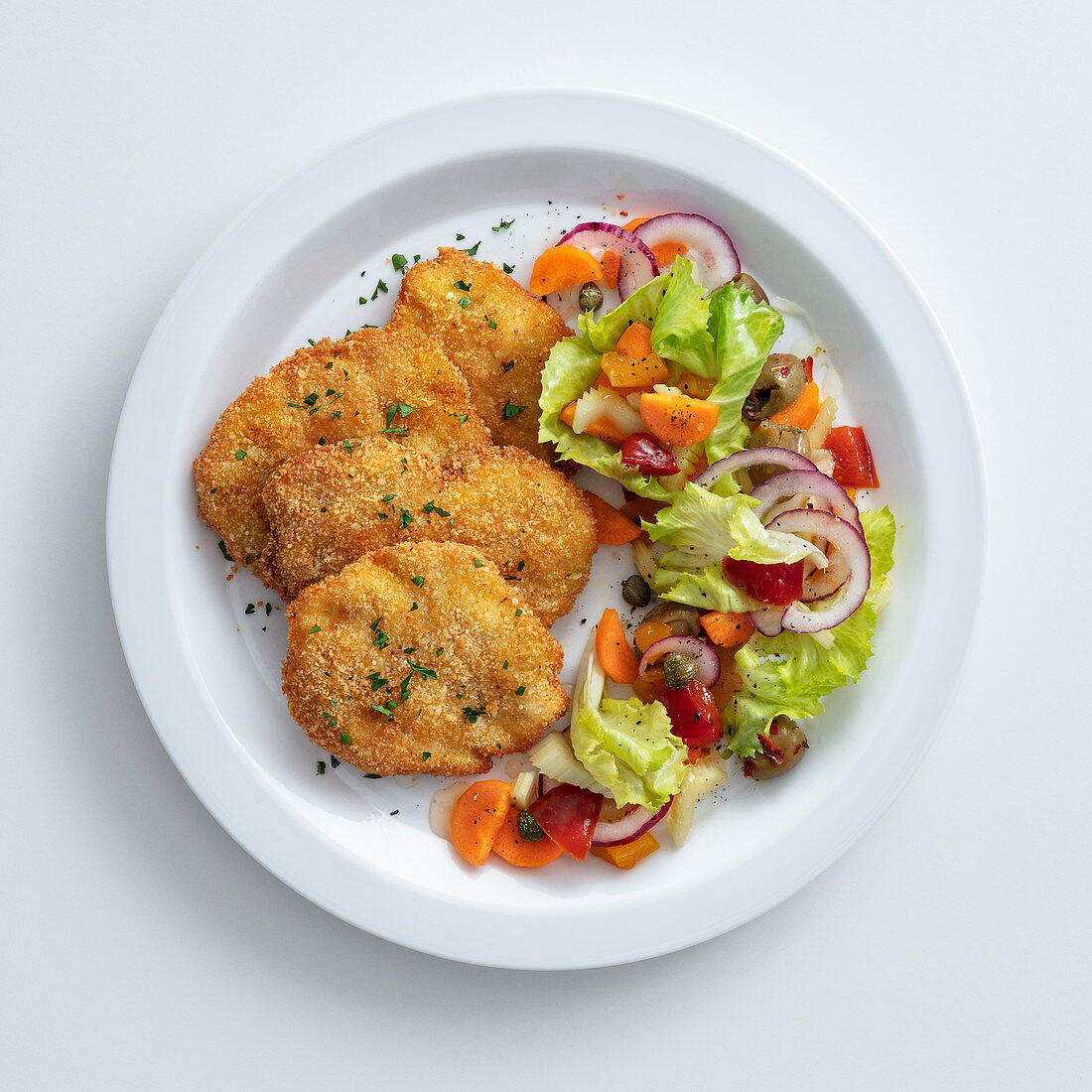 Sicilian-style chicken escalope with Mediterranean salad