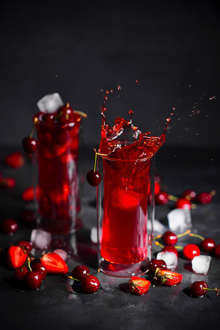 Strawberry, rhubarb and cherry drink with ice