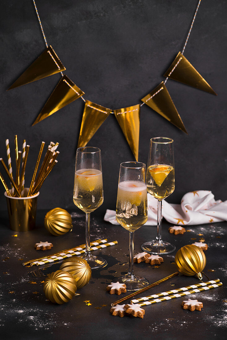 New Years Eve champagne glasses with golden decorations