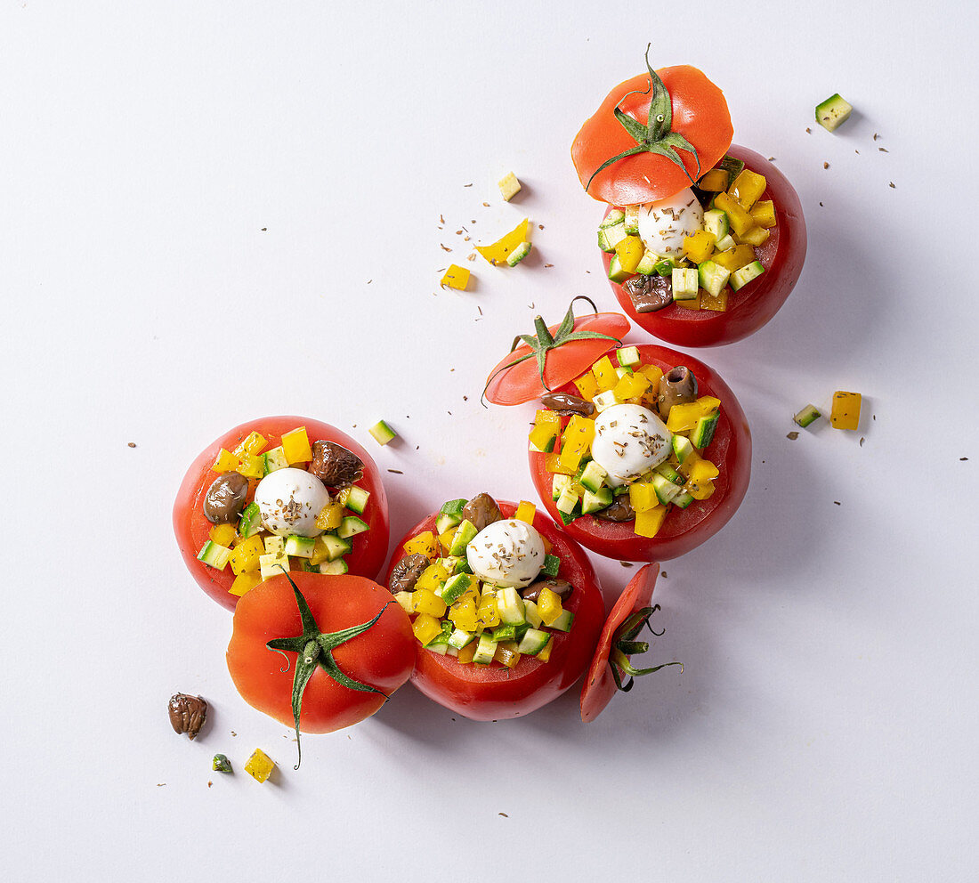 Tomatoes filled with vegetables and mozzarella