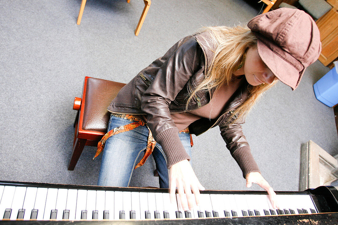 Music student playing piano