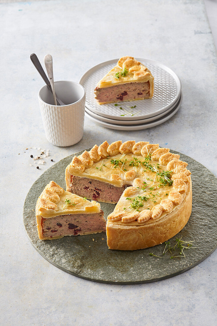 Pork pie with chicken and cranberries, sliced