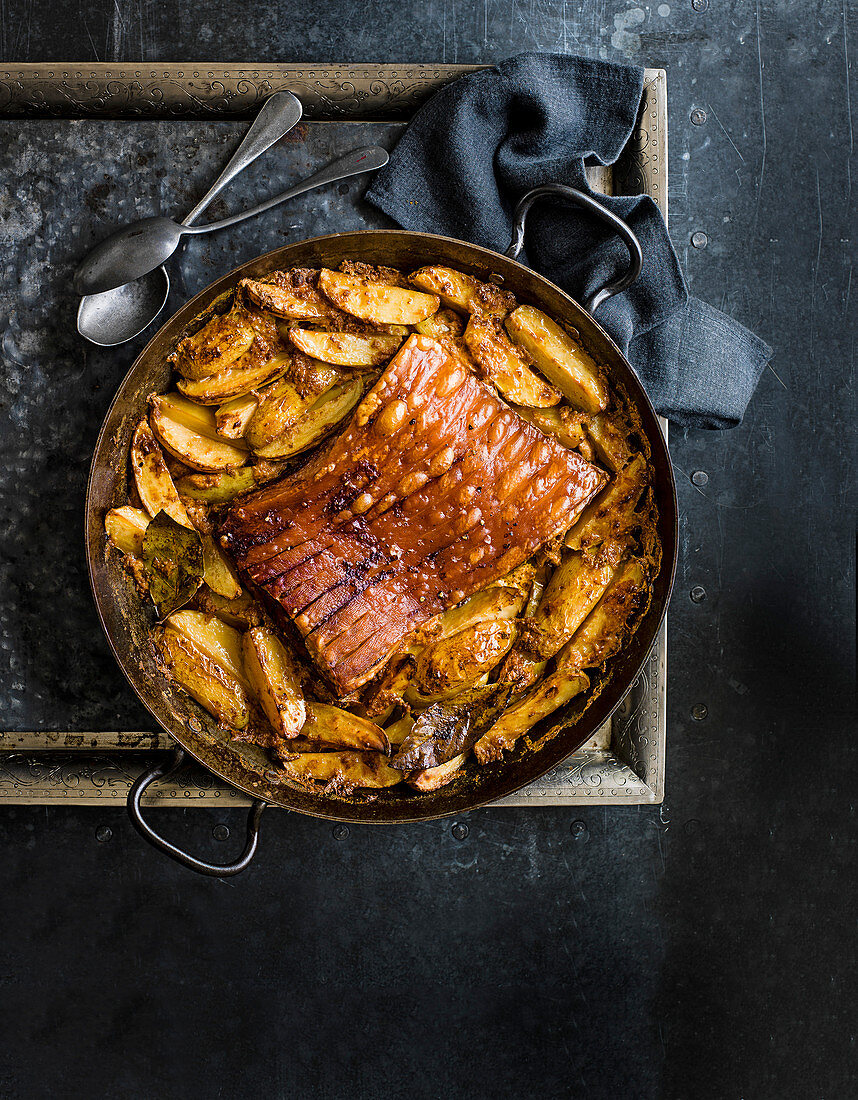 Roast pork belly with potatoes