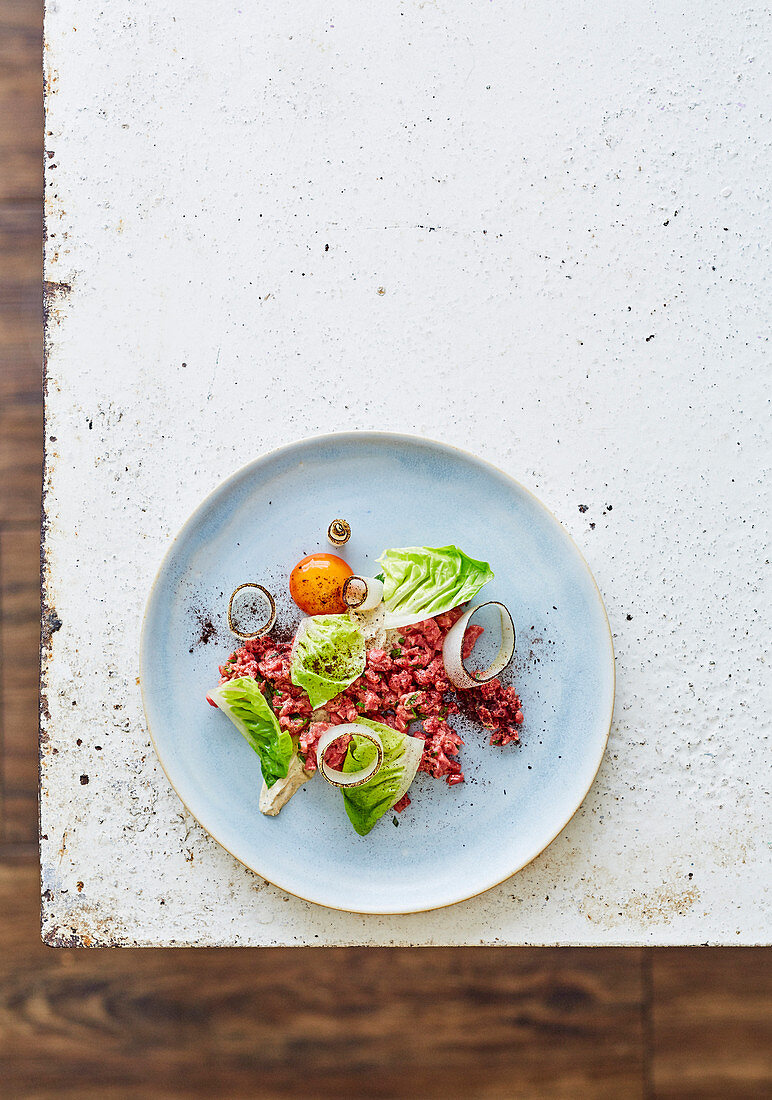 Aged beef tartare with onion ash