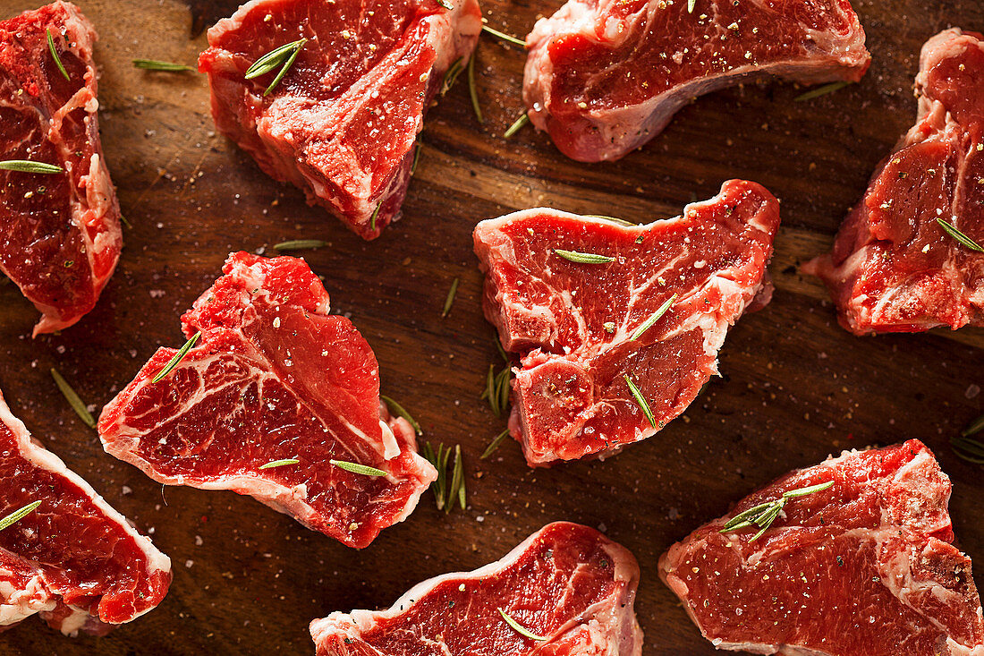 Raw lamb chops with salt and pepper