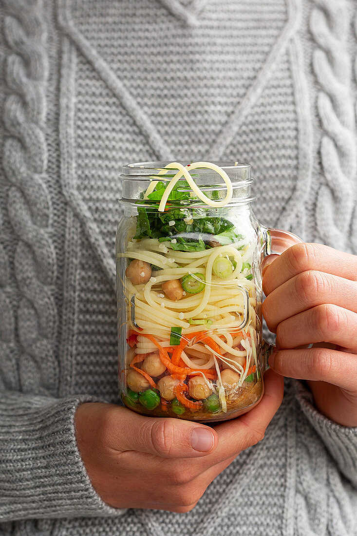 Girl Holding Noodle Jar