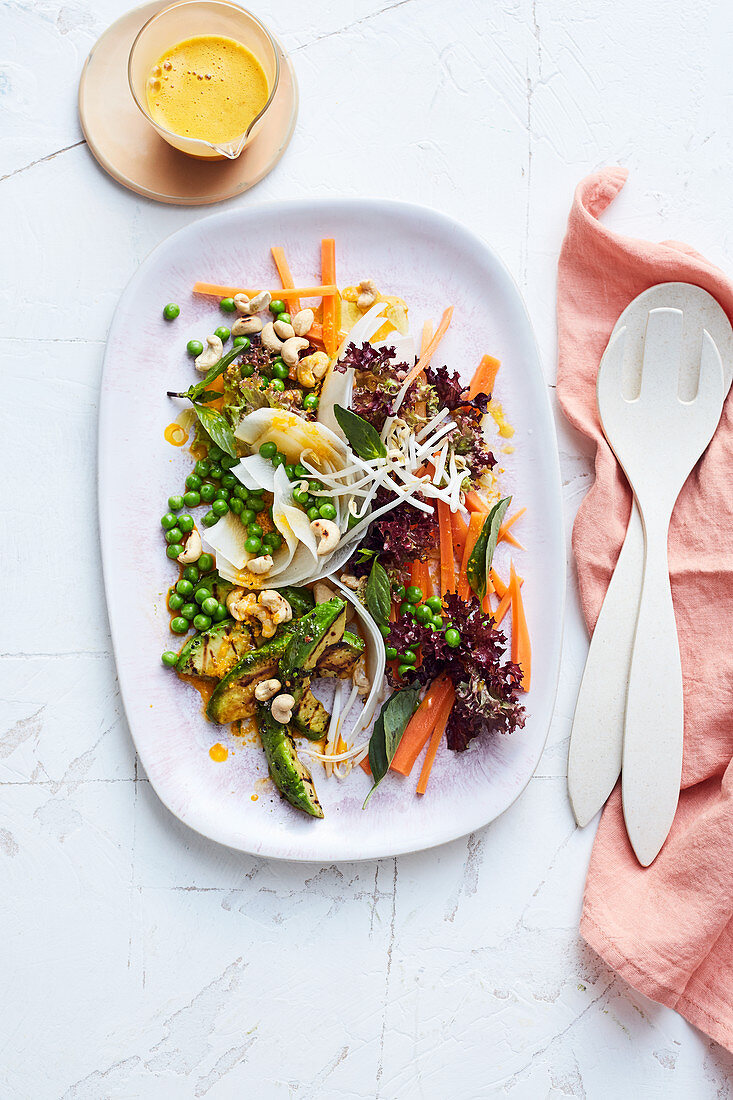 Lollo rosso with peas, ginger and a carrot dressing