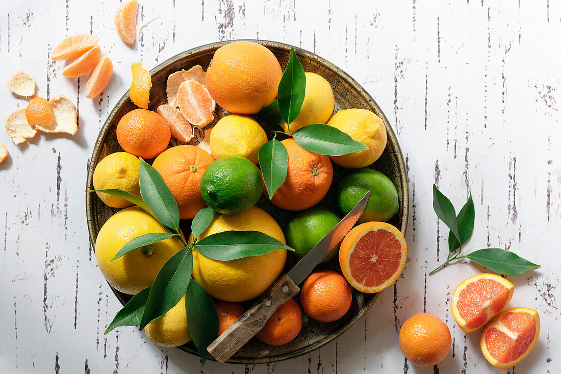 Variety of citrus fruits in a ceramic bowl
