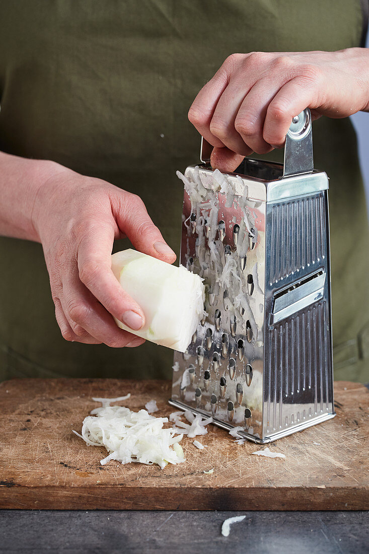 Root vegetables being grated