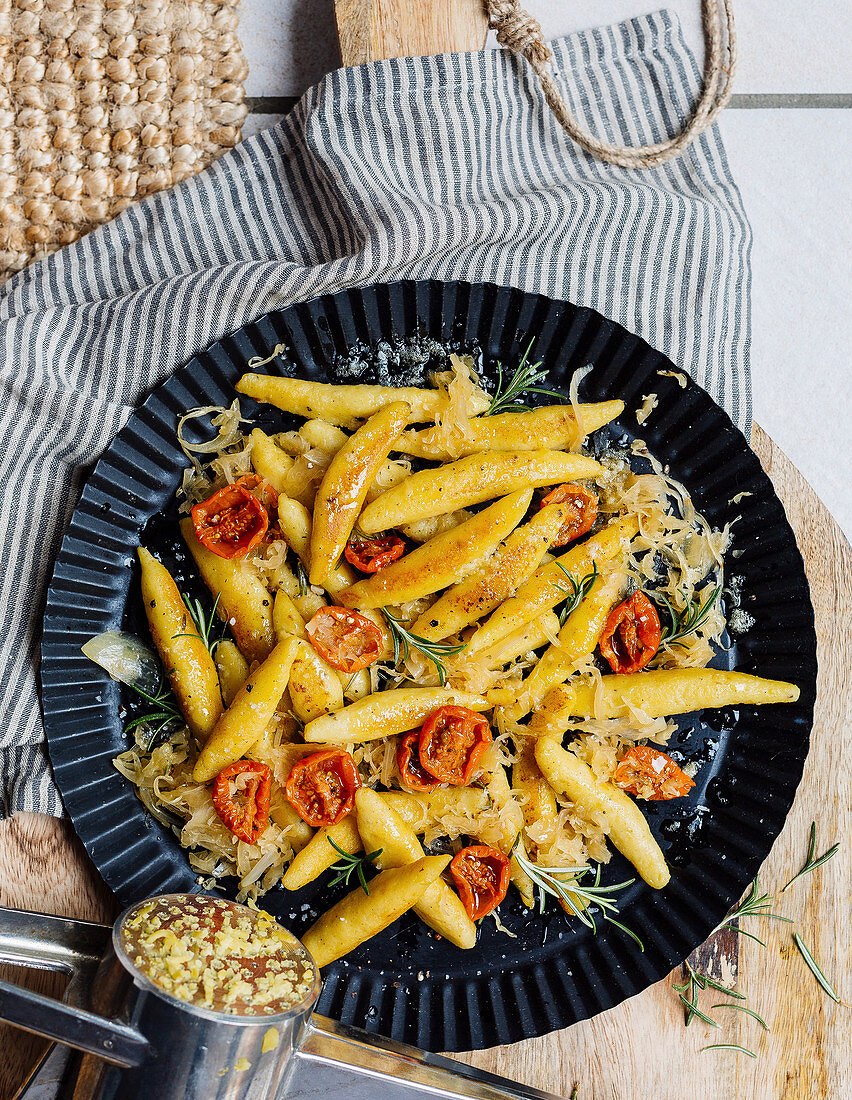 Potato orzo pasta with sauerkraut and dried tomatoes