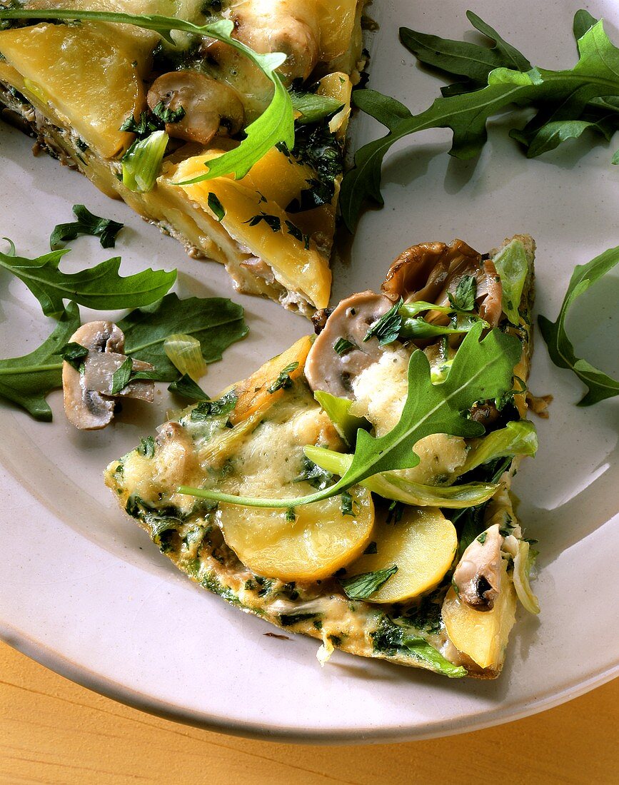 Pizza with potatoes, mushrooms, rocket