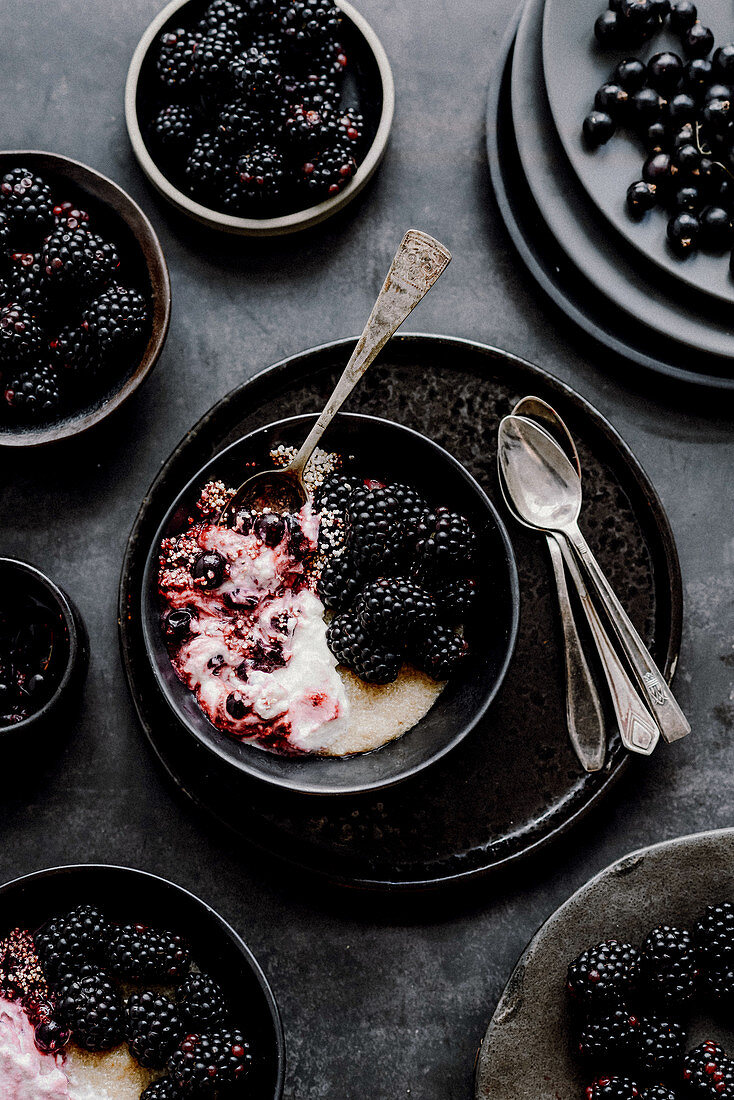 Breakfast pudding with blackberries, black currants, coconut cream and amaranth