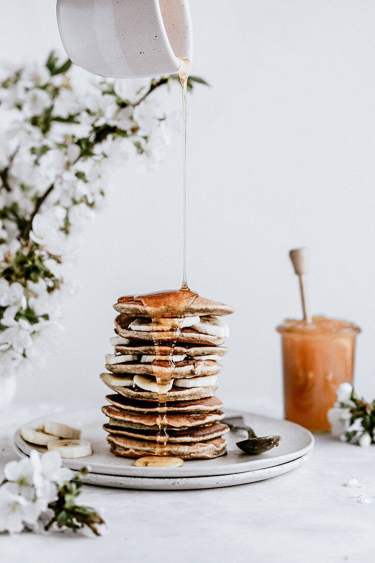 Banana pancakes topped with honey