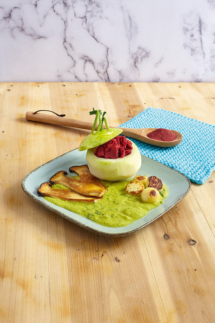 Filled kohlrabi with herb sauce and beetroot and potato mash