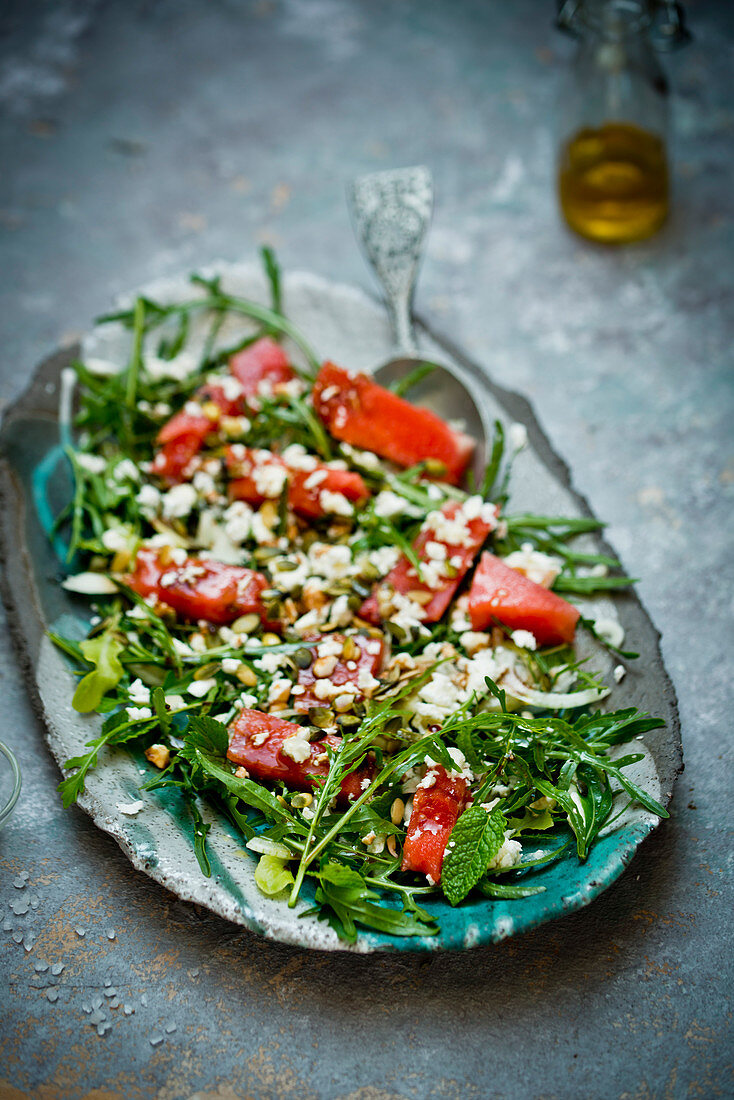 Rocket salad with watermelon and herbs