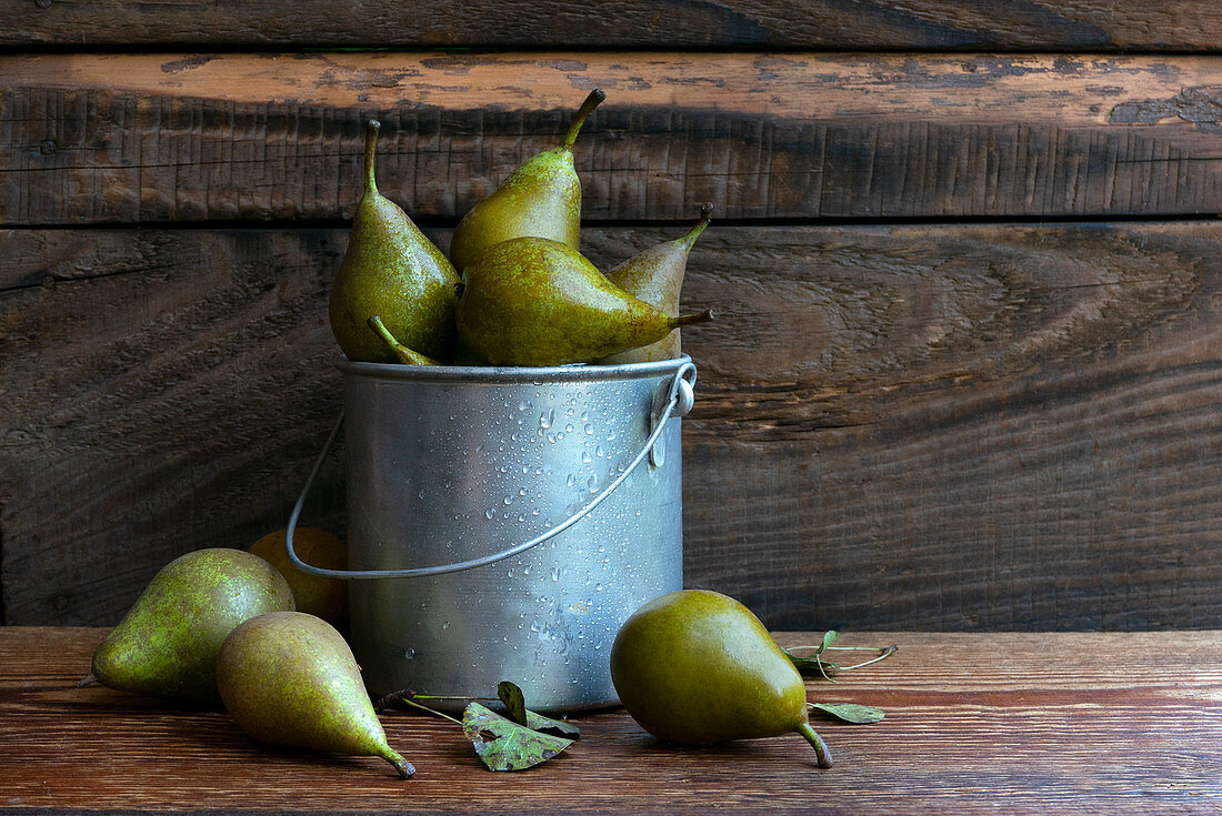 Small pears on a wooden rustic table in the garden