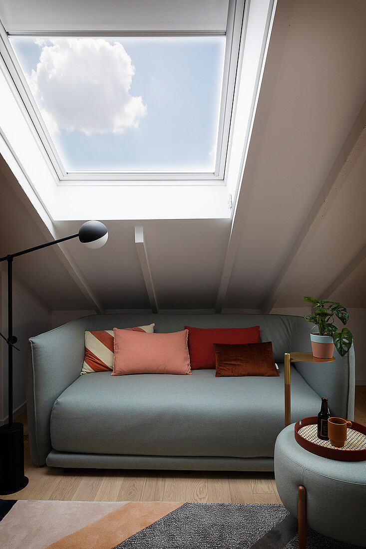 Light gray sofa and matching coffee table under the roof