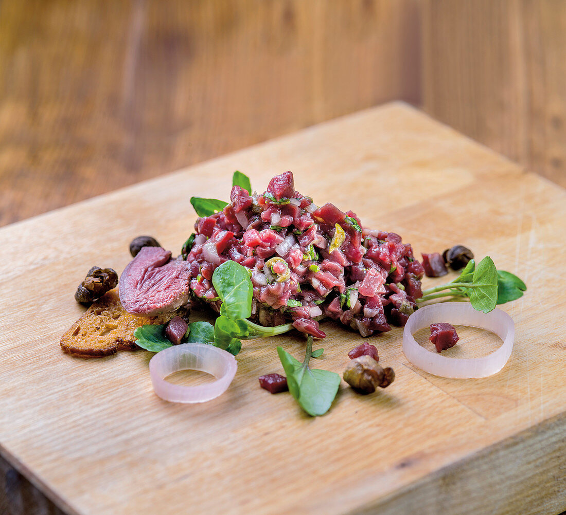 Duck heart tartare and pink roast duck heart with watercress