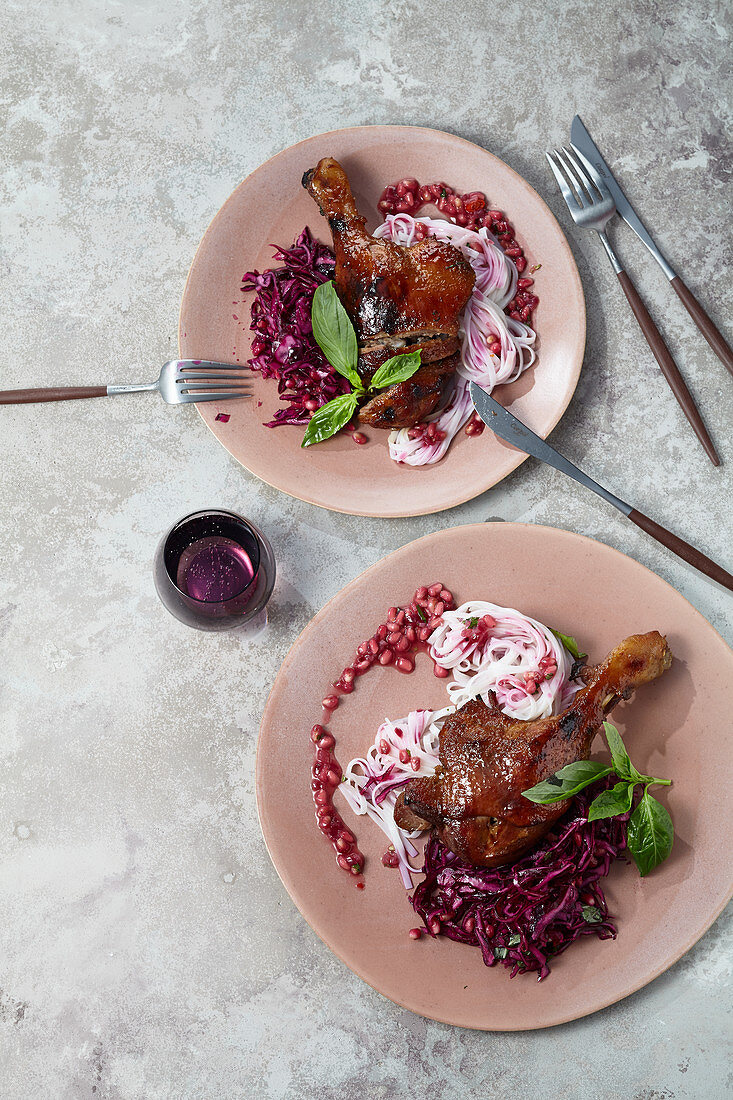 Roasted duck leg with rice noodles and pomegranate relish