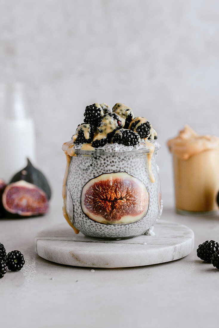 Chia pudding with fresh figs, peanut butter and blackberries
