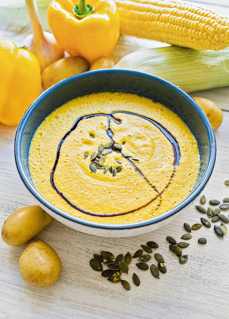 Corn, pepper and potato soup with pumpkin seed oil