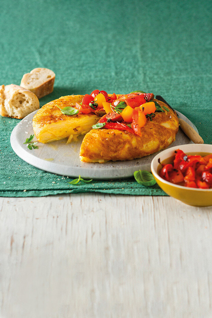 Spanish omelette with red pepper and tomato salad