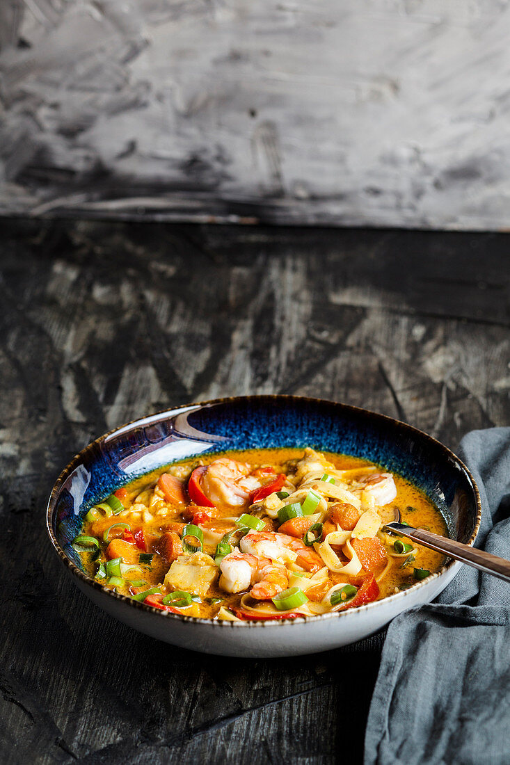 Thai style fish curry with rice noodles and prawns