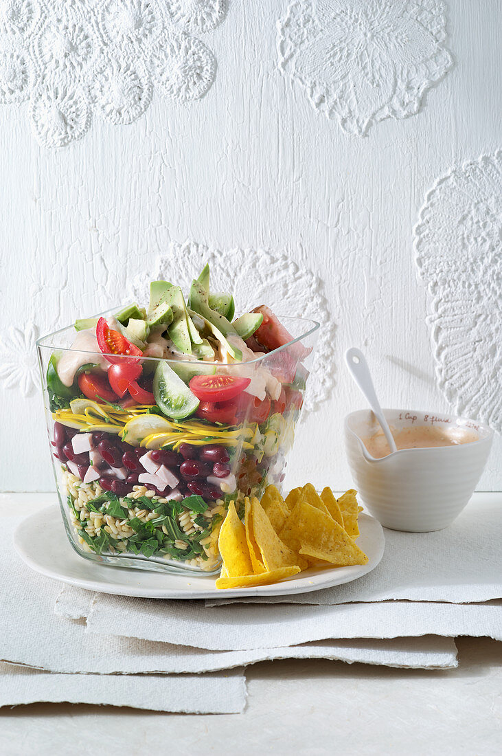 Colorful 'Flower Power' layered salad with wheat and turkey