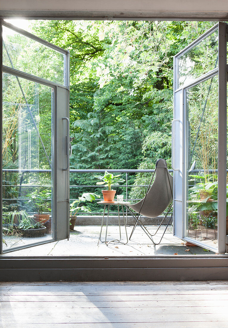 A view through open double doors onto a terrace