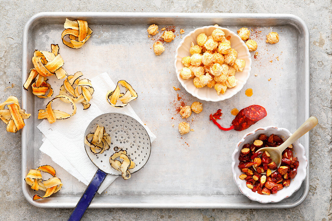 Fried salsify, seasoned popcorn, chorizo and almonds as toppings
