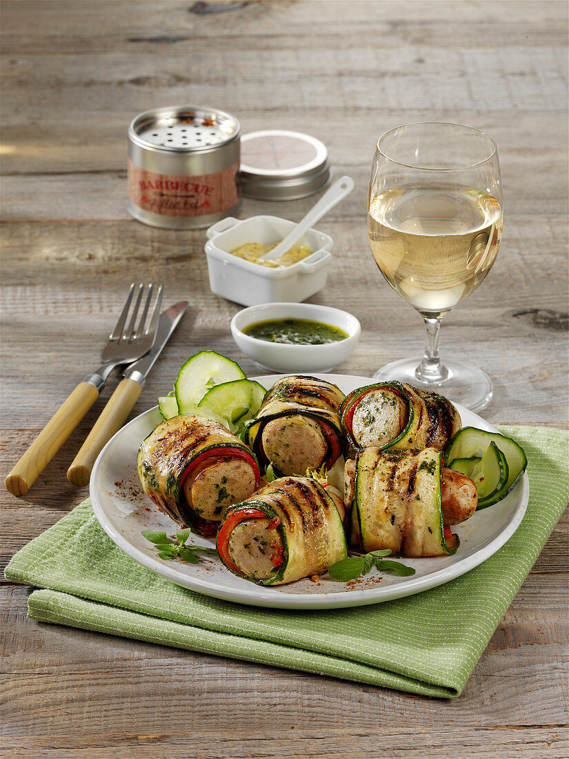 Grilled sausages wrapped in zucchini