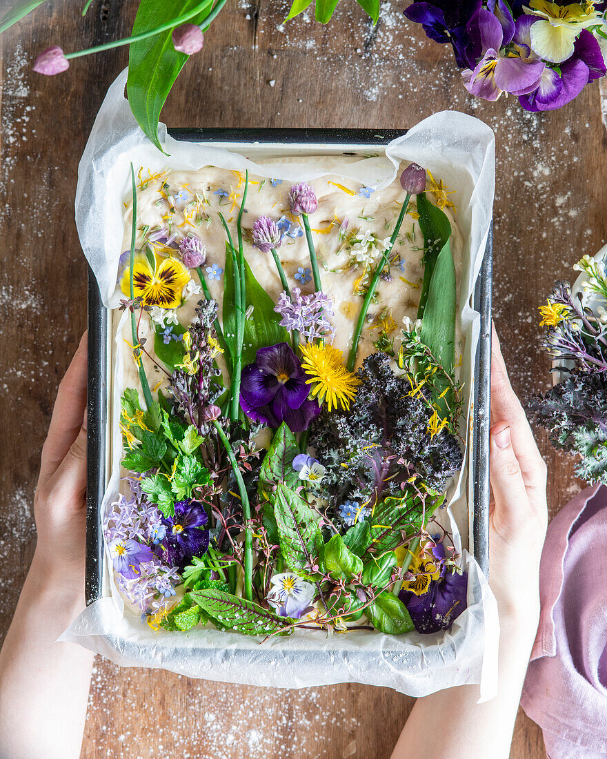 Focaccia with herbs and edible flowers (unbaked)