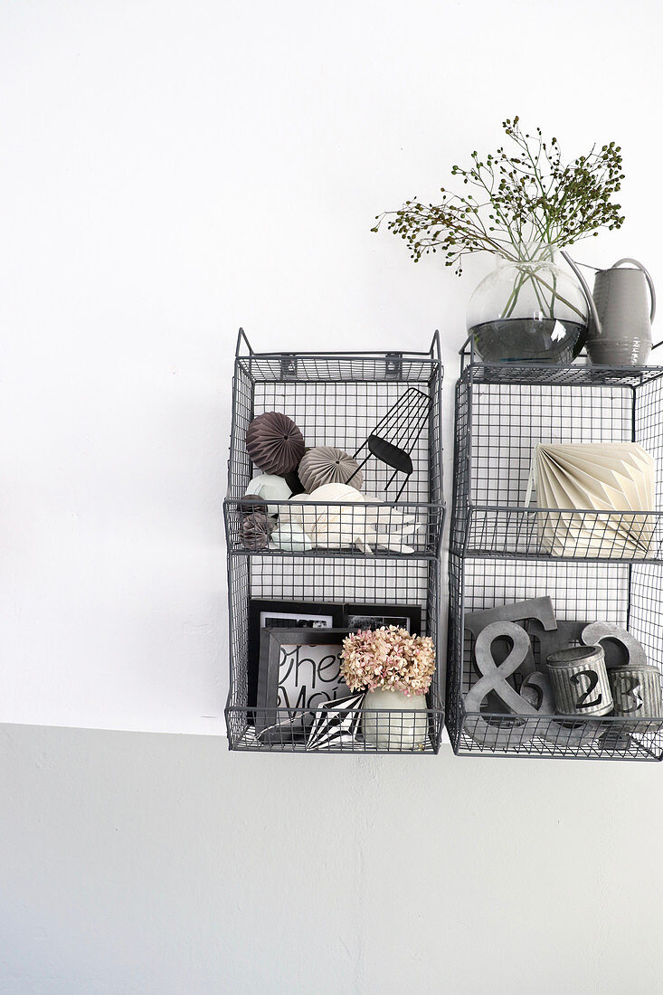 Vintage-style accessories on metal, wall-mounted shelves