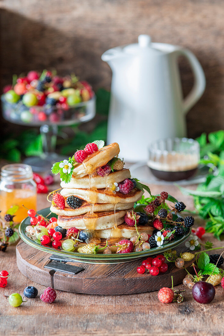 Pancakes with berries and honey