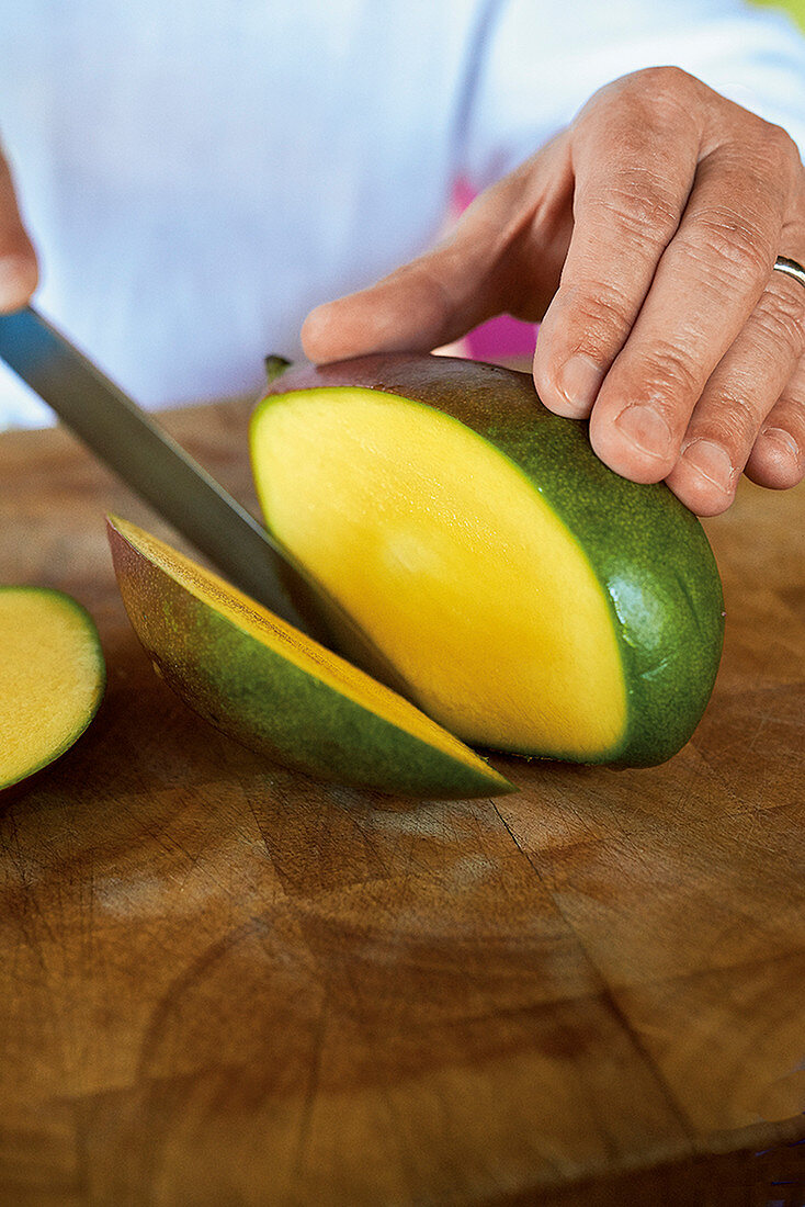 A mango being cut