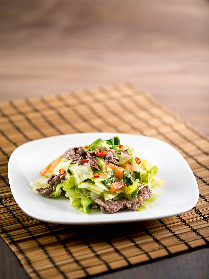 Chinese beef salad with iceberg lettuce, vinegar and chilli