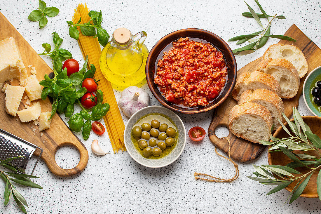 Italian Tomato Bolognese sauce, spaghetti, cheese parmesan, ripe olives, ciabatta and snacks