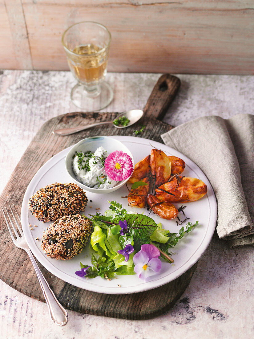 Carrot and spelt patties with herb quark and potatoes