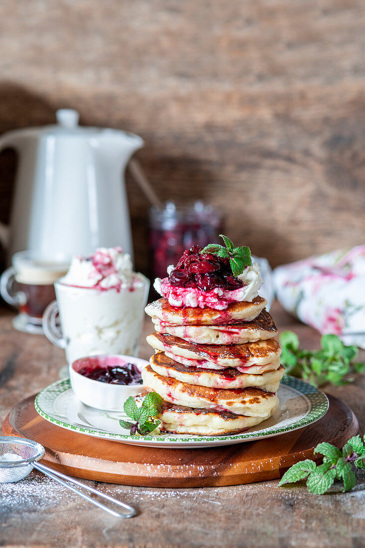 Pancakes with cream cheese and cherries