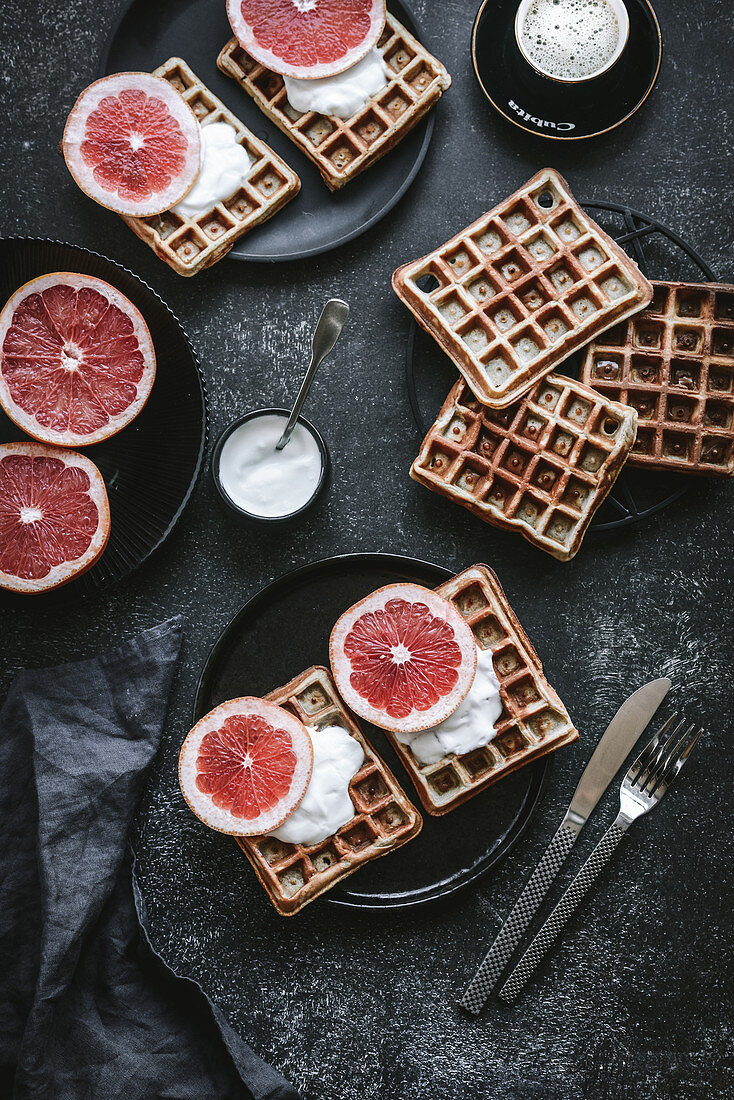 Waffles with whipped cream and grapefruit