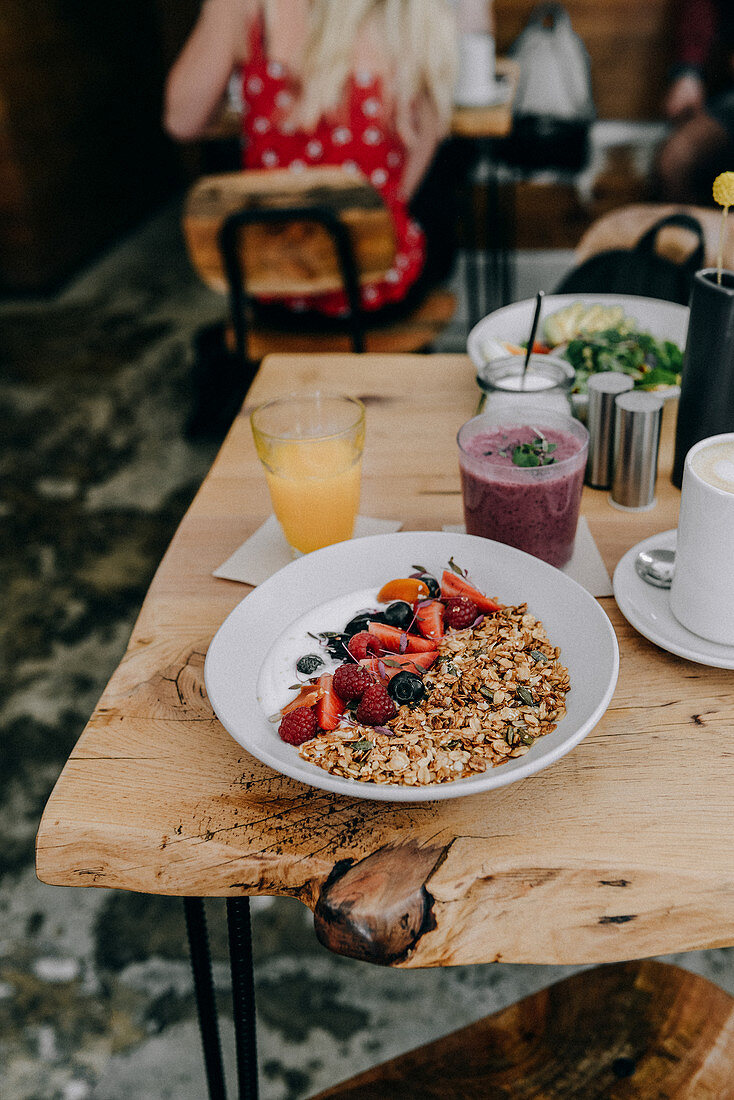 Yoghurt with granola, strawberries, raspberries and blueberries