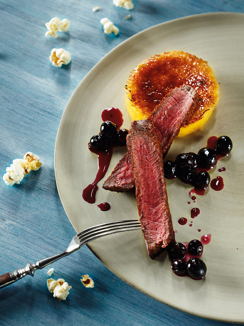 Venison rump with blueberries and sweetcorn crème brûlée made in a beefer